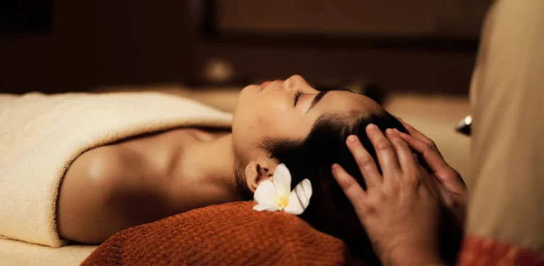 CHI The Spa treatment room at Shangri-La Rasa Ria with natural wood decor and soft lighting