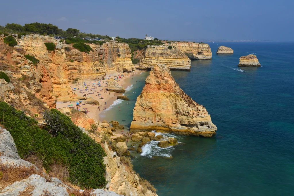 The golden cliffs and turquoise water of Praia da Marinha on the central Algarve coast