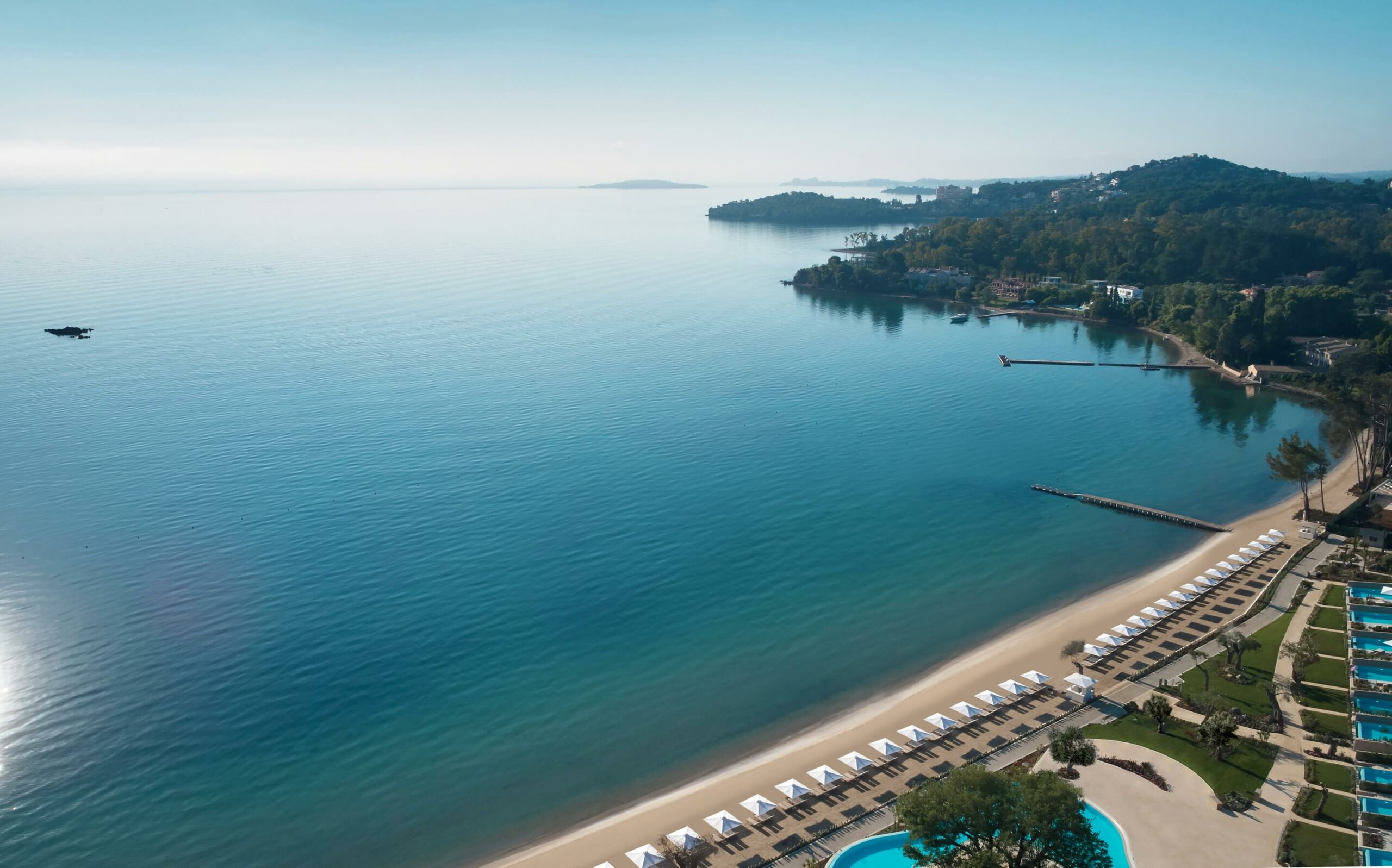 Aerial view of the beach and bay at Ikos Dassia, Corfu, Greece