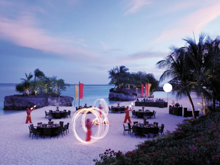 A fire-dance performance at a beachfront dinner setup on Treasure Island, Shangri-La Mactan, Cebu