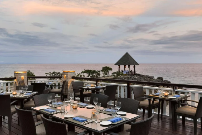 An oceanfront dining terrace at sunset, Shangri-La Mactan, Cebu