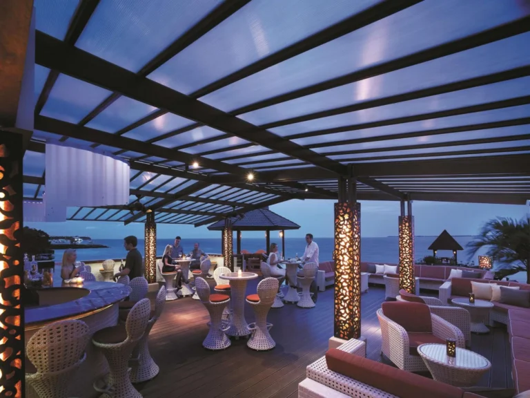 The oceanfront rooftop bar and lounge at dusk, Shangri-La Mactan, Cebu