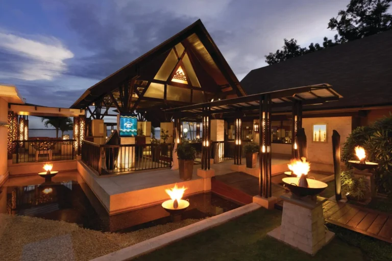 The Cowrie Cove restaurant pavilion lit up at dusk, Shangri-La Mactan, Cebu