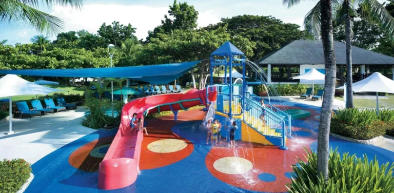 Children play on the water slide and Aquaplay structure at Shangri-La Mactan, Cebu's kids' pool area