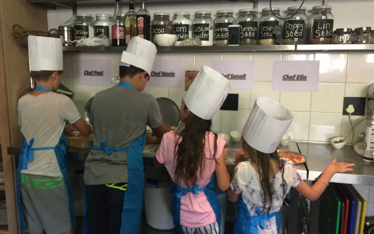 Children taking part in a cooking lesson at Morukuru Family Madikwe