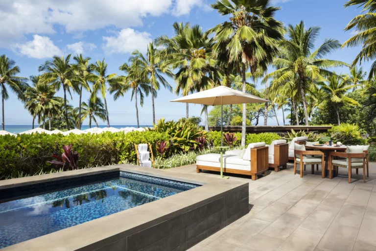 Pacific Suite private plunge pool and outdoor terrace at Four Seasons Resort Oahu surrounded by tropical garden and ocean view