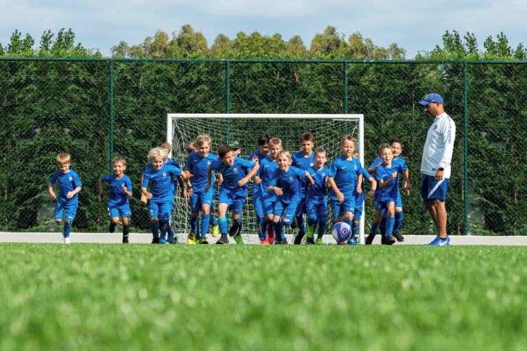 Young players training with a coach at the Chelsea FC Football Academy, Sani Resort