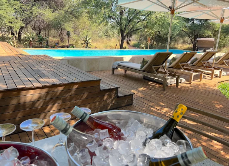Private Morukuru swimming pool and timber deck with a drinks cooler in the foreground