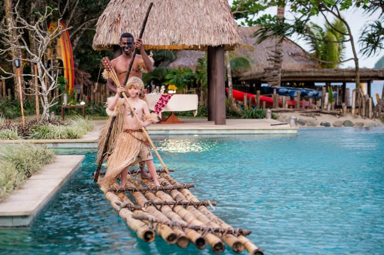 Traditional Fijian fire-lighting ceremony at Nanuku Resort with guests watching