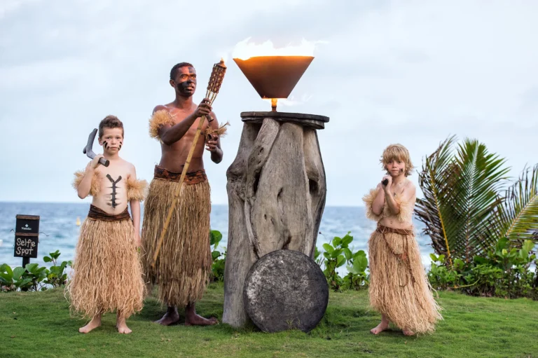 Torch-lighting ceremony at Nanuku Resort Fiji at dusk