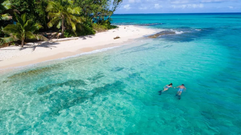 Guests on a boat excursion from Nanuku Resort Fiji toward the Beqa Lagoon