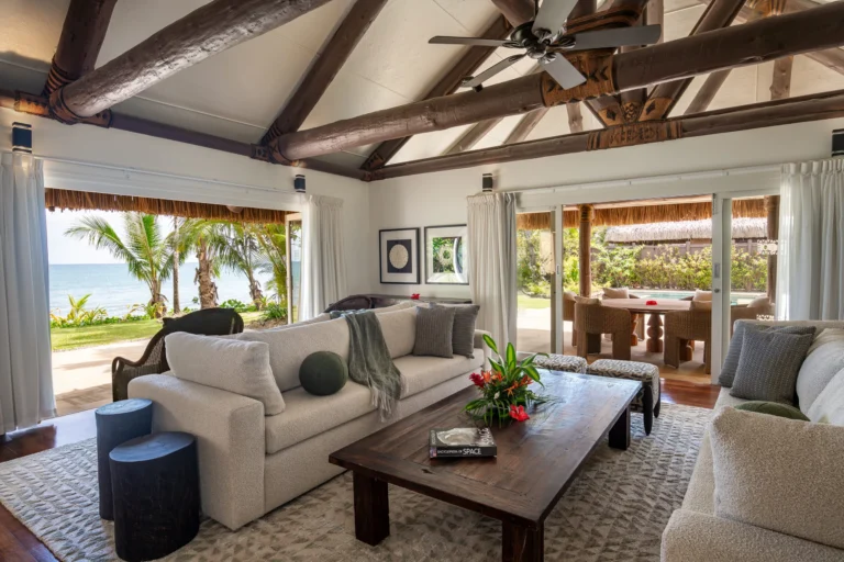 Living area and pool terrace connection at Nanuku Resort beachfront residence