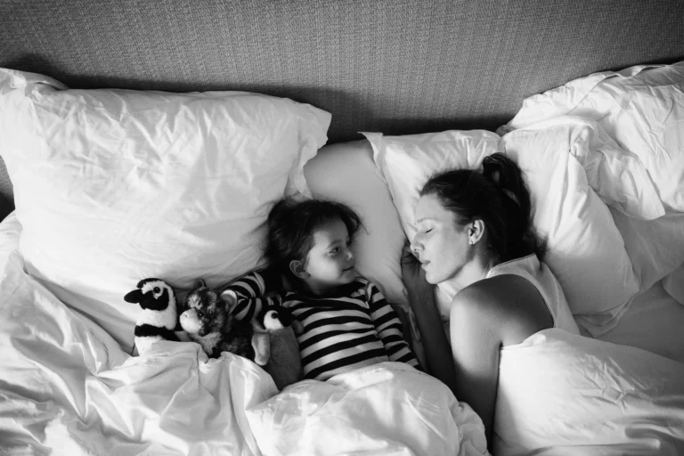 Parent and child relaxing in a family suite