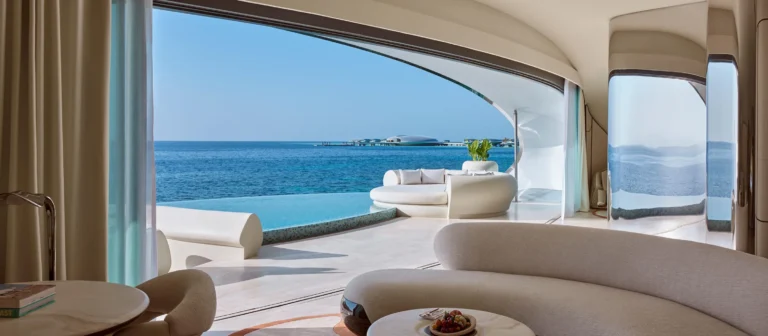 Villa bedroom at Shebara Resort with floor-to-ceiling glass and Red Sea views