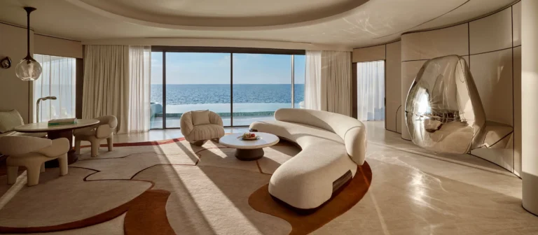 Private deck of overwater villa at Shebara Resort with direct sea ladder access above the reef