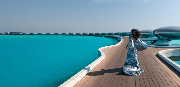 Wide panorama of Shebara Resort villa clusters and connecting jetties over the Red Sea