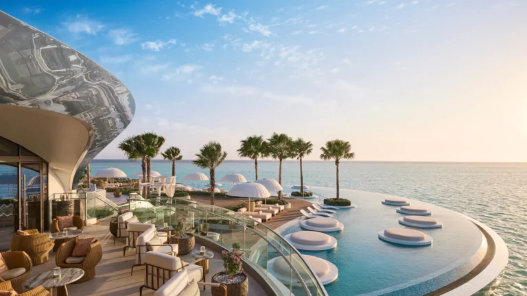 Pool area at Shebara Resort with infinity edge and Red Sea horizon beyond