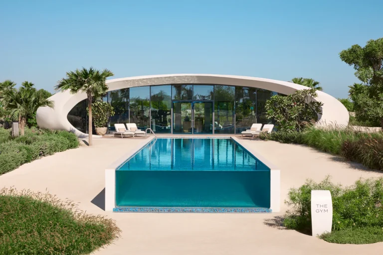 Guest suite interior at Shebara Resort with custom furnishings and ocean-view windows