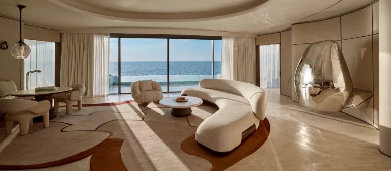 Private deck of overwater villa at Shebara Resort with direct sea ladder access above the reef