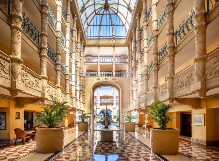 Grand columned atrium and lobby hall inside The Palace of the Lost City