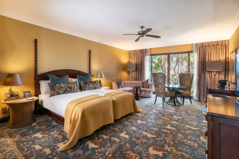 Twin Room with African-motif carpet and safari-style furnishings