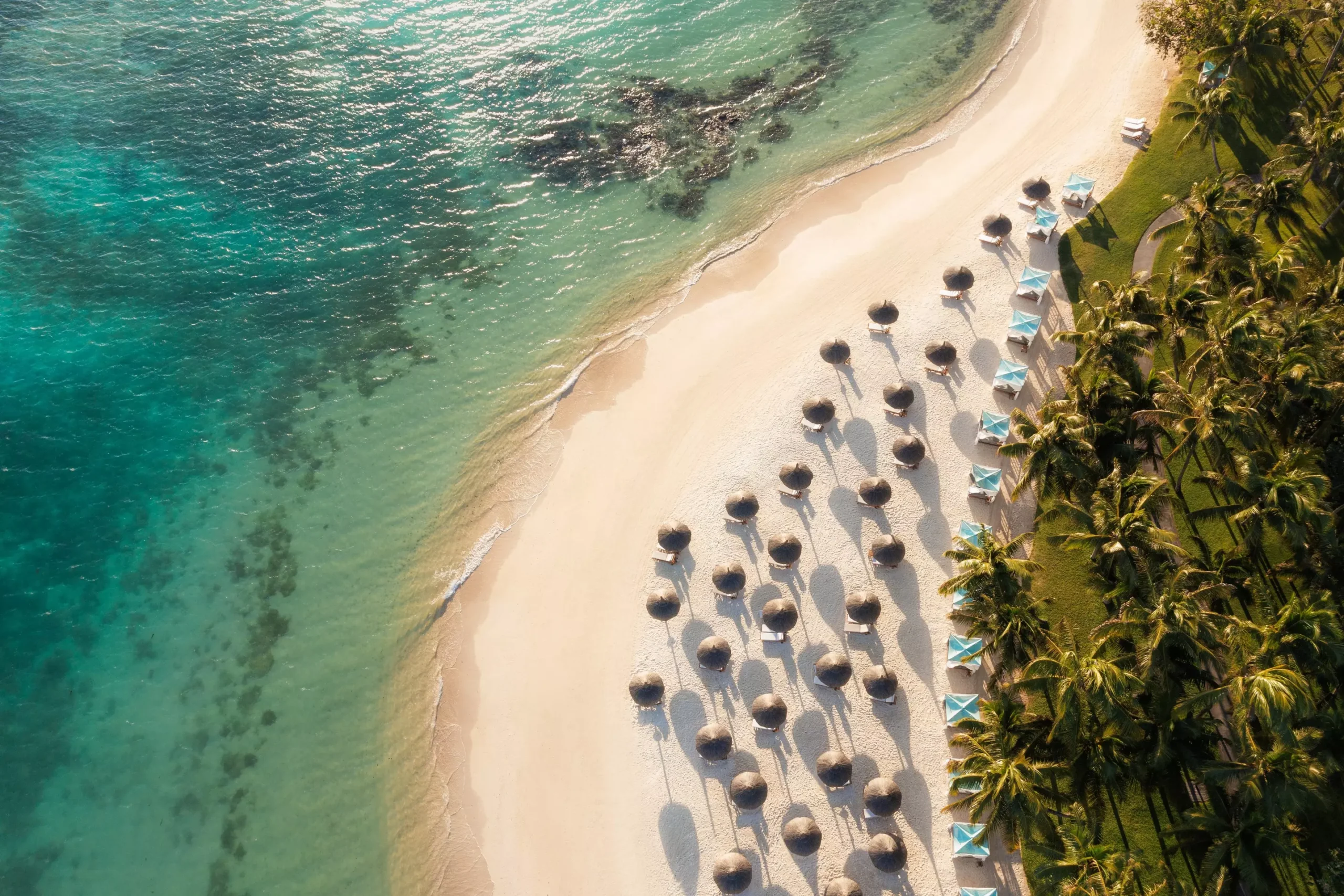 Aerial view of One&Only Le Saint Géran private peninsula with beach, tropical gardens and Indian Ocean, Mauritius