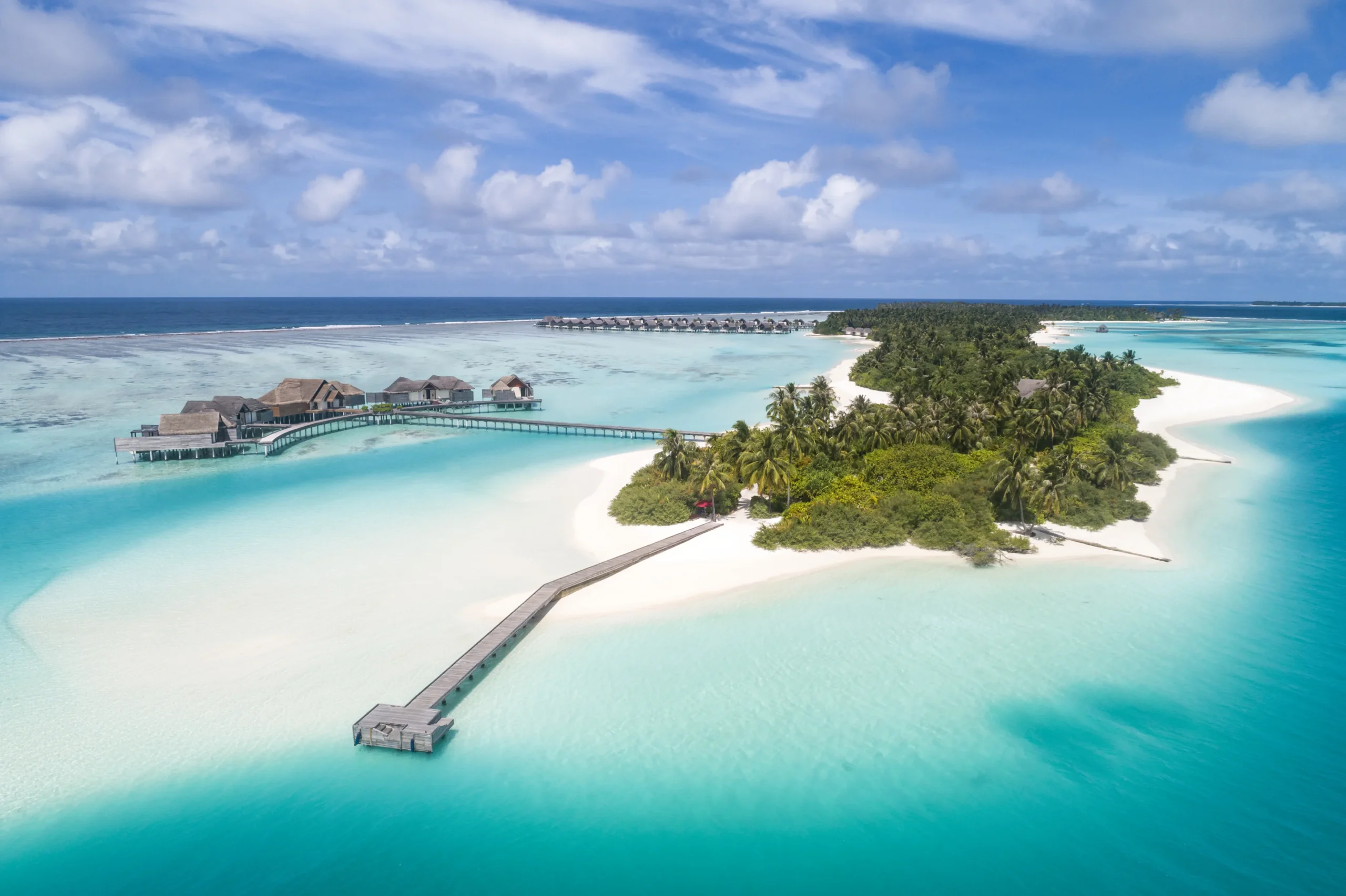 Aerial view showing both Play and Chill, the two islands of Niyama Private Islands Maldives, joined by their connecting bridge