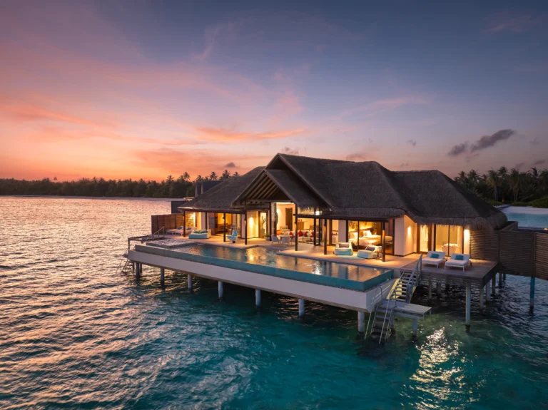 Twilight exterior view of a Two Bedroom Ocean Pool Pavilion and its private pool