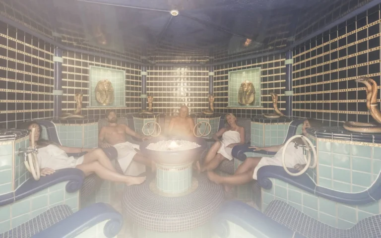 Adults relaxing in a themed steam room at Cavallino Bianco spa