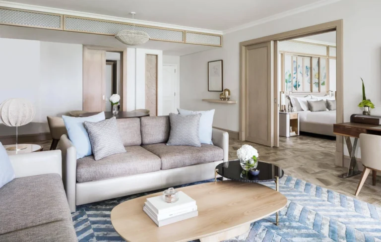 Ocean Suite living room at One&Only Le Saint Géran with wide floor-to-ceiling windows and ocean panorama