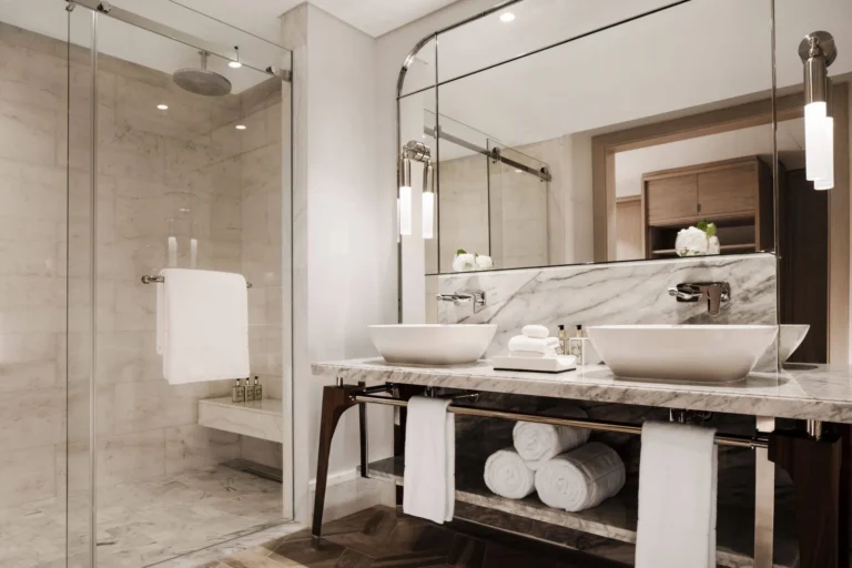 Two-Bedroom Family Suite bathroom at One&Only Le Saint Géran — double vanity, marble fittings, bathtub