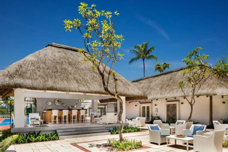 Club One courtyard bar and outdoor seating area at One&Only Le Saint Géran — poolside social hub