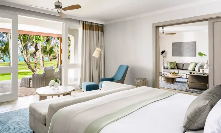 Beachfront Suite bedroom at One&Only Le Saint Géran with ocean view terrace, neutral tones