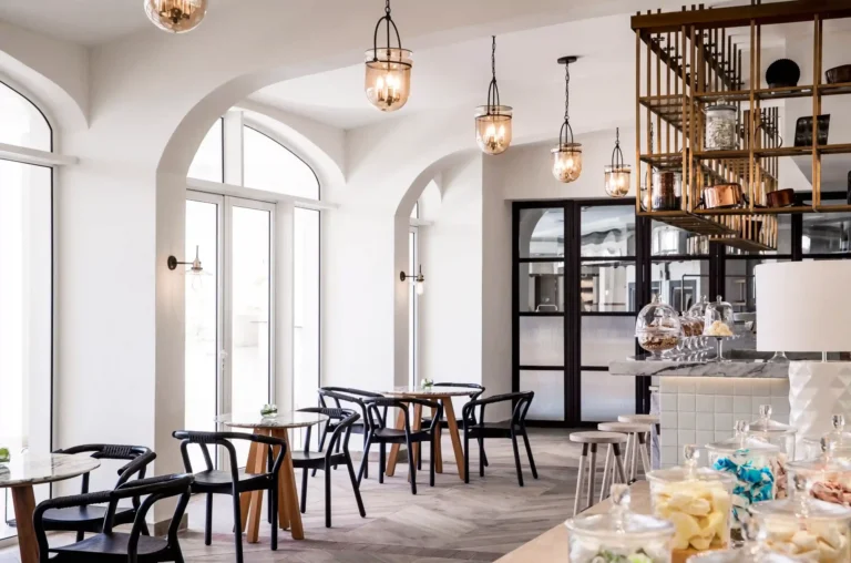 L'Artisan café and bakery interior at One&Only Le Saint Géran — marble counter, pastry display, artisan bread