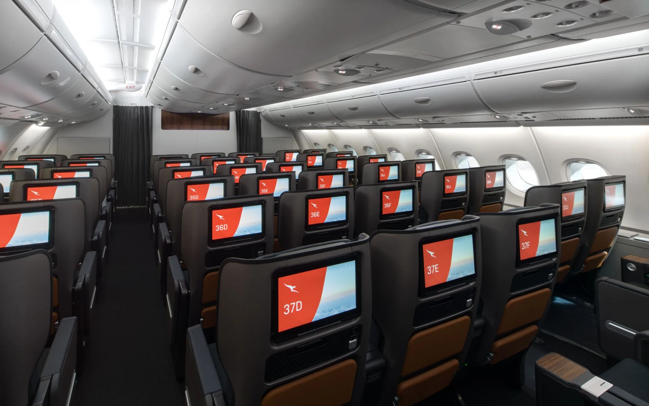 Empty Qantas A380 Premium Economy cabin on the upper deck, seat numbers showing the 2-3-2 layout