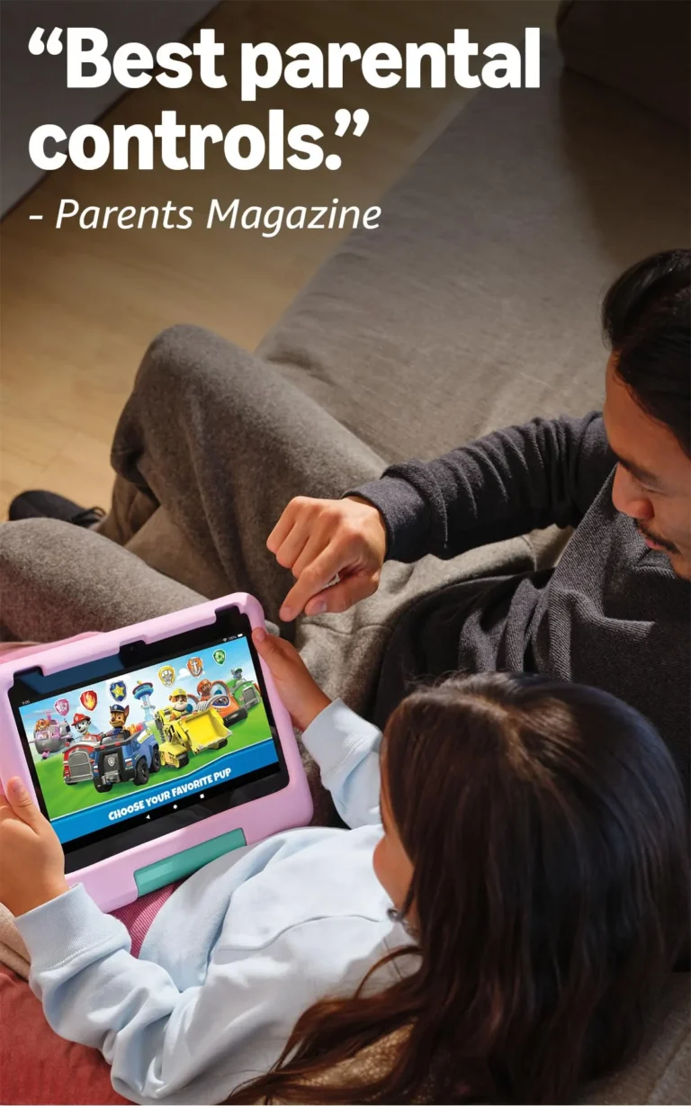 Father and young child lying together on a sofa, with the child holding the Amazon Fire HD 10 Kids tablet in pink case showing a Paw Patrol game