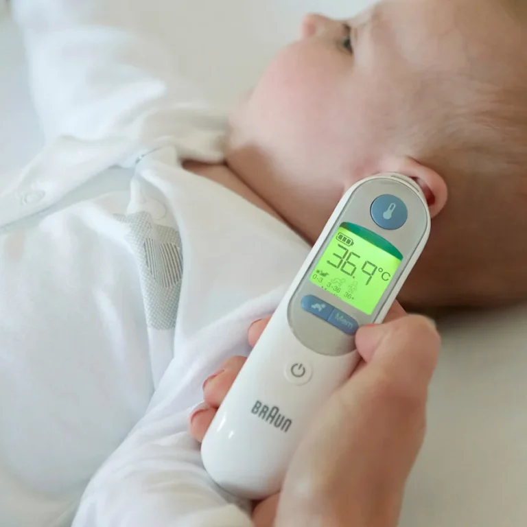 Braun ThermoScan 7 IRT6520 — lifestyle shot showing product in real-world family use