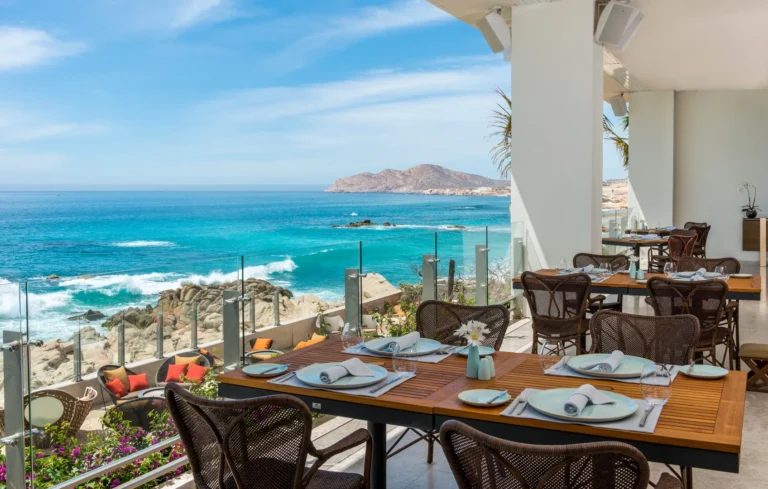 Velas 10 seaside dining tables at sunset at Grand Velas Los Cabos