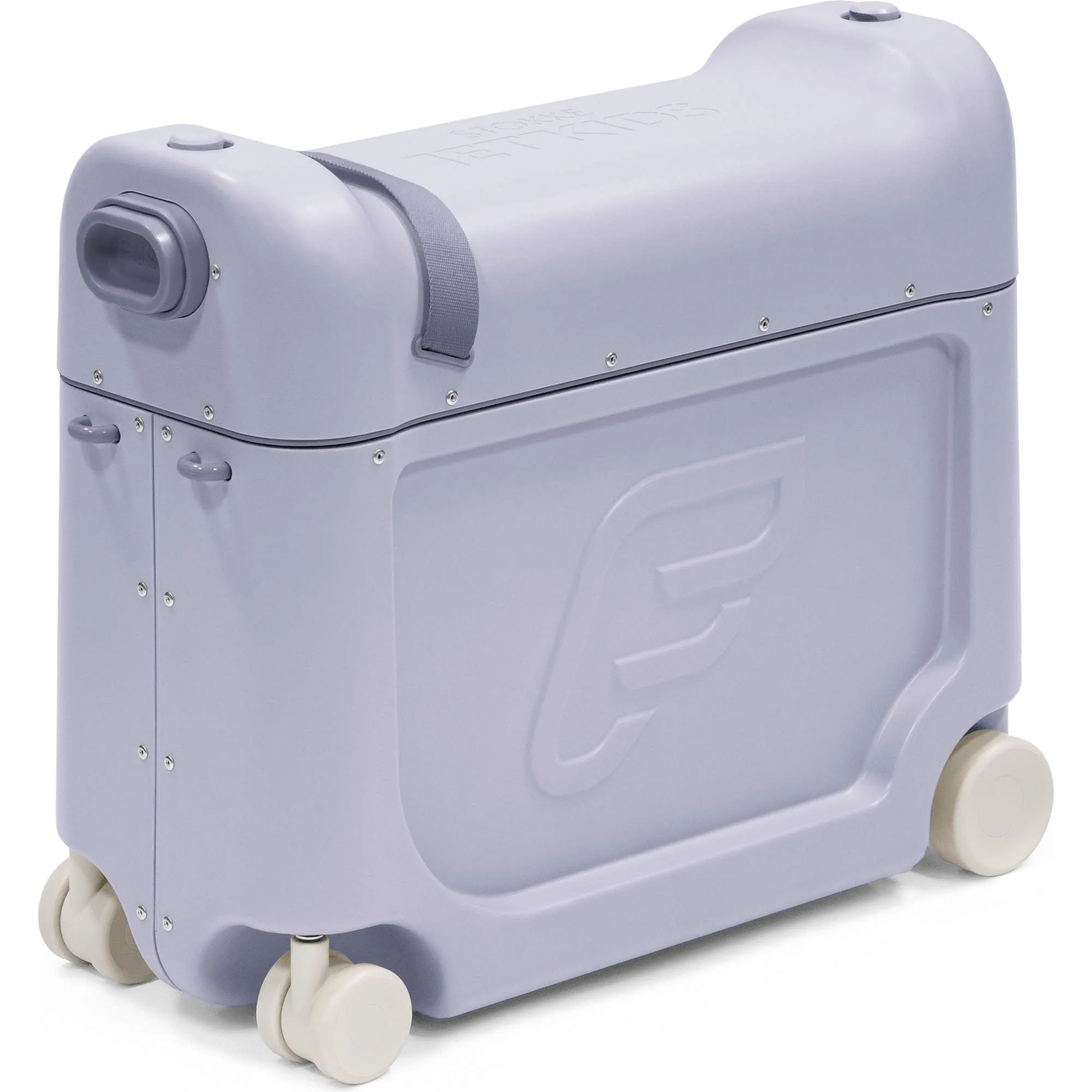 Child riding on the Stokke JetKids BedBox through a busy airport terminal, parent pulling the telescoping handle