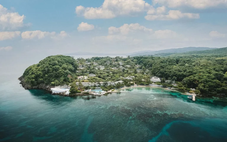 Aerial view of the wooded Round Hill peninsula seen from the sea