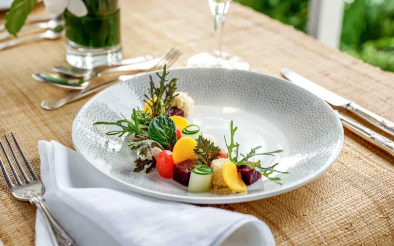 Plated vegetable starter on a woven table mat