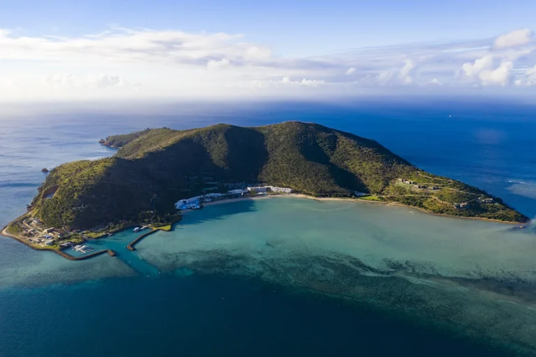 Aerial view of Hayman Island with its marina breakwater and reef flat in the Coral Sea