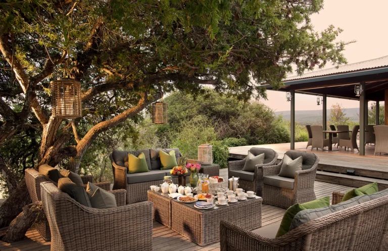 Breakfast laid out on the terrace of Kwandwe Ecca Lodge at sunrise